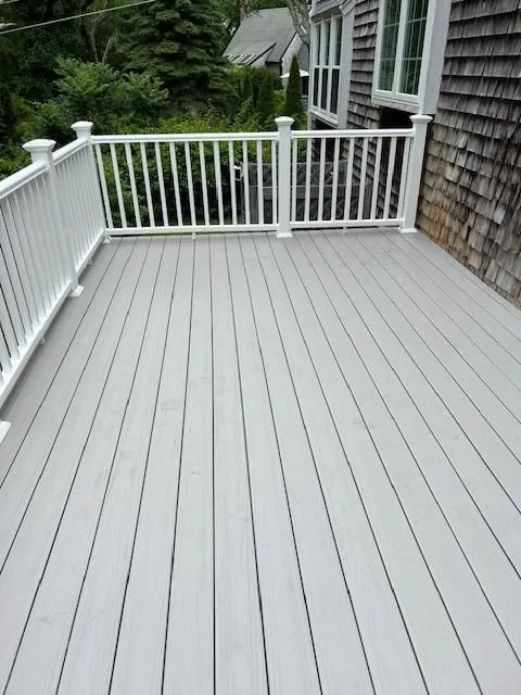 Gray composite deck with white vinyl railing