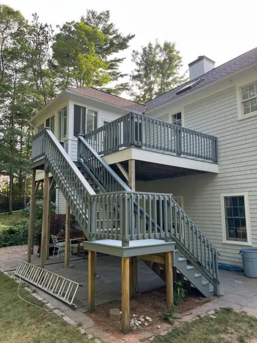 Second story deck with a long staircase built on new posts